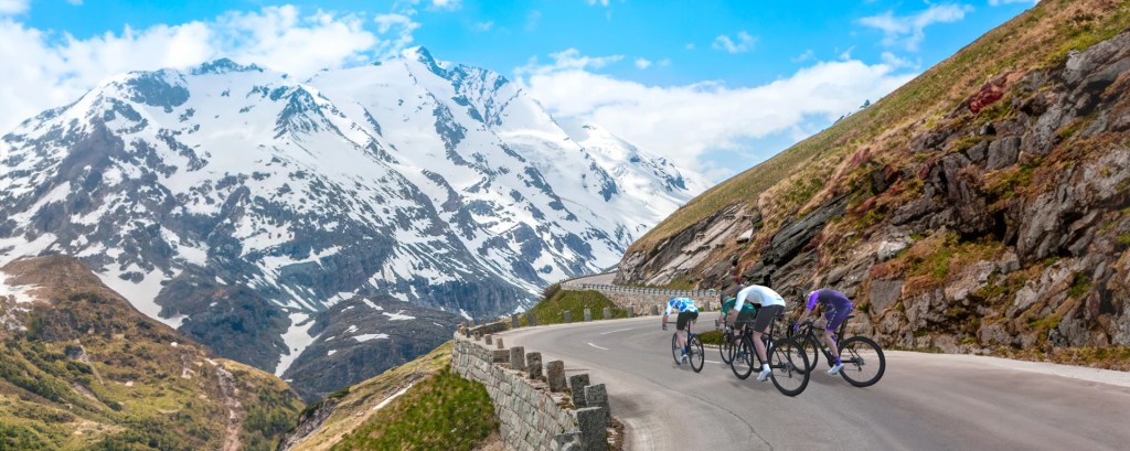 Rouvy cycling app showing UK countryside virtual ride on tablet beside gravel bike