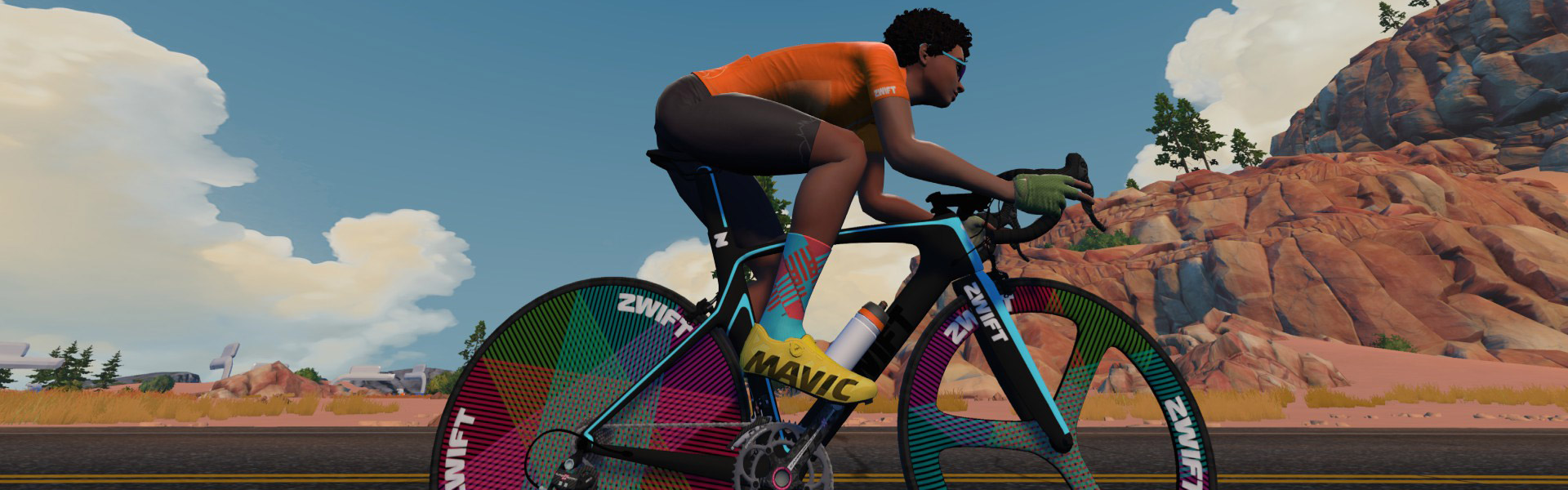 Beginner gravel cyclist over 50 using Zwift app on laptop with turbo trainer
